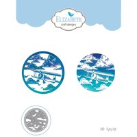 "Flying High" craft die set with two circular designs featuring vintage airplanes and clouds in blue and white tones.
