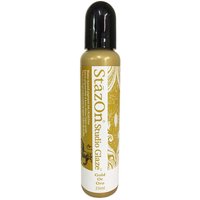 Gold Tsukineko StazOn Studio Glaze bottle with black cap, gold label, and decorative white accents, 60ml.