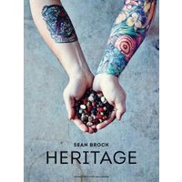 "Heritage book cover with tattooed arms holding assorted beans against a textured gray background"