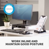 Black and silver Fellowes document holder with adjustable angle, holding papers upright on a desk.