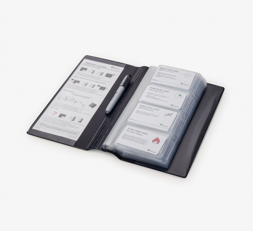 Green Paxton Proximity 50 Card Pack displayed in a black folder, featuring multiple white function cards with icons and text instructions, alongside a silver pen.