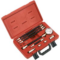 Red Sealey VSE206 petrol compression test kit with gauge, hoses, and adapters in a molded carrying case.