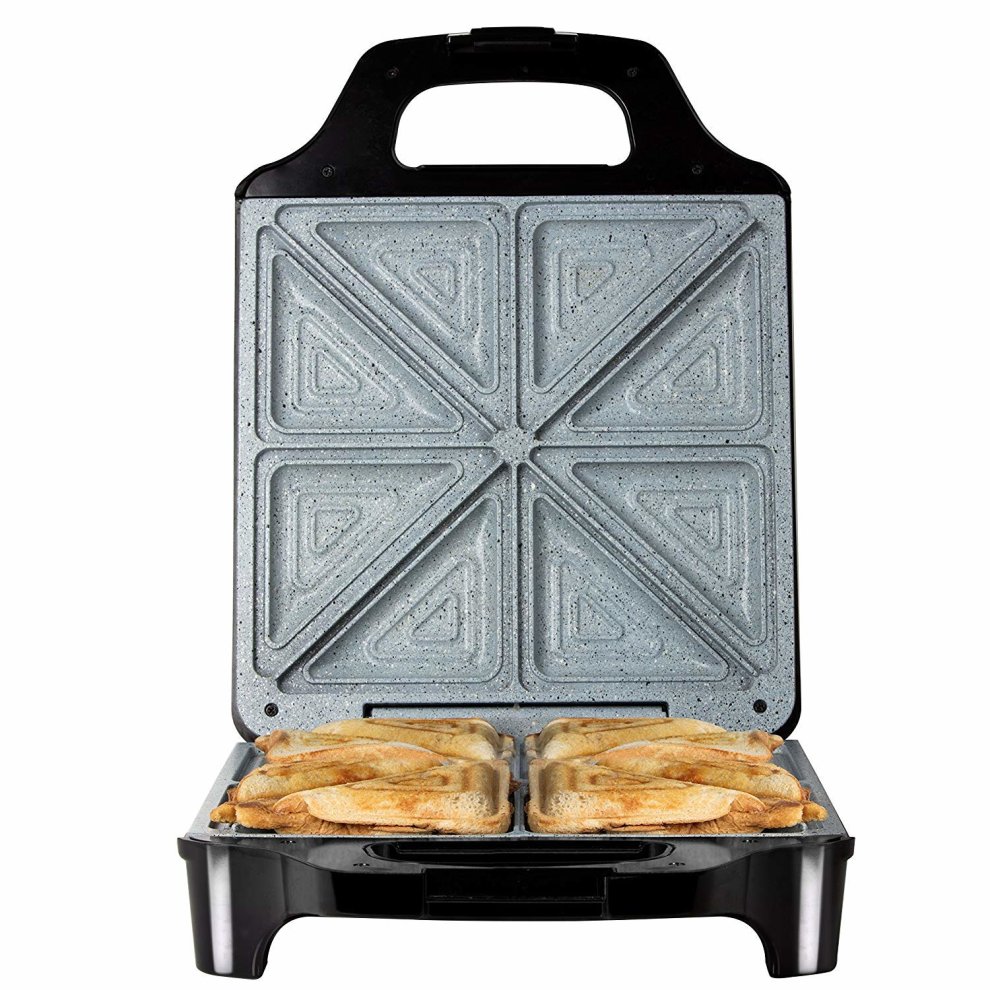 Black and silver 1600W Tower sandwich maker with a textured non-stick cooking surface, featuring four triangular compartments for toasting sandwiches.