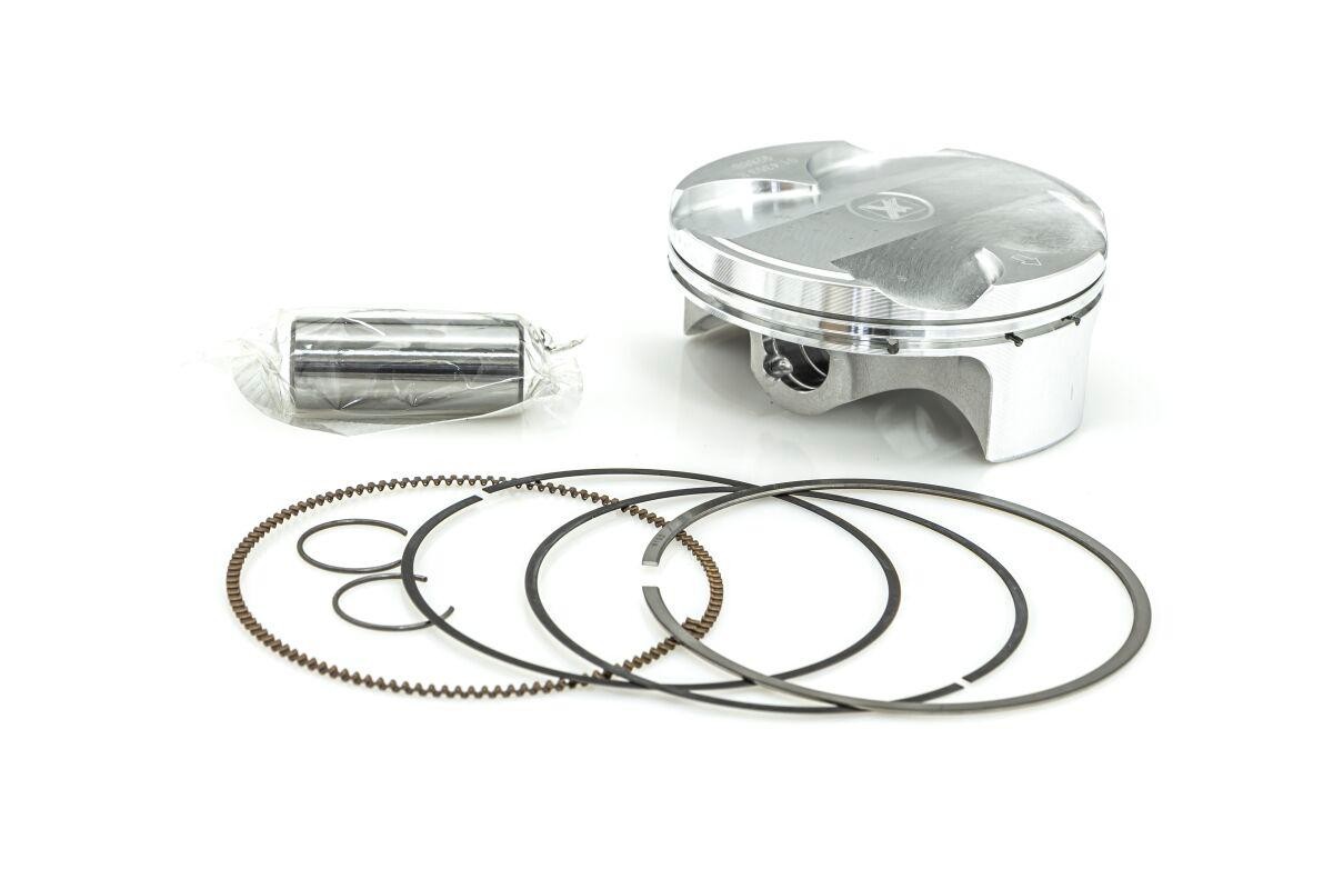 ProX Prox Piston Kit for Kawasaki KX250 (2023-2024) includes a shiny silver piston, a metal wrist pin, and multiple black piston rings, all designed for standard size B.