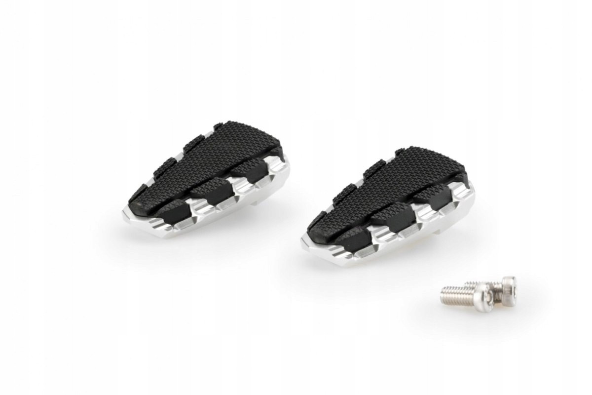 Silver Puig Trail 2 footpegs featuring a textured black rubber surface for grip, designed for KTM 1050 Adventure models from 2015 to 2016, with a metal mounting screw included.