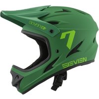Green 7Protection M1 full face MTB helmet with visor, ventilation slots, and bold yellow "7" logo on the side.
