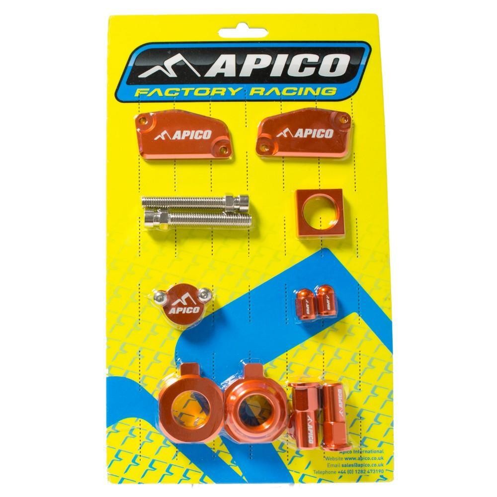 Bright orange aluminum motorcycle accessories arranged on a yellow backing, featuring various components like spacers, clamps, and bolts, all branded with the Apico logo.