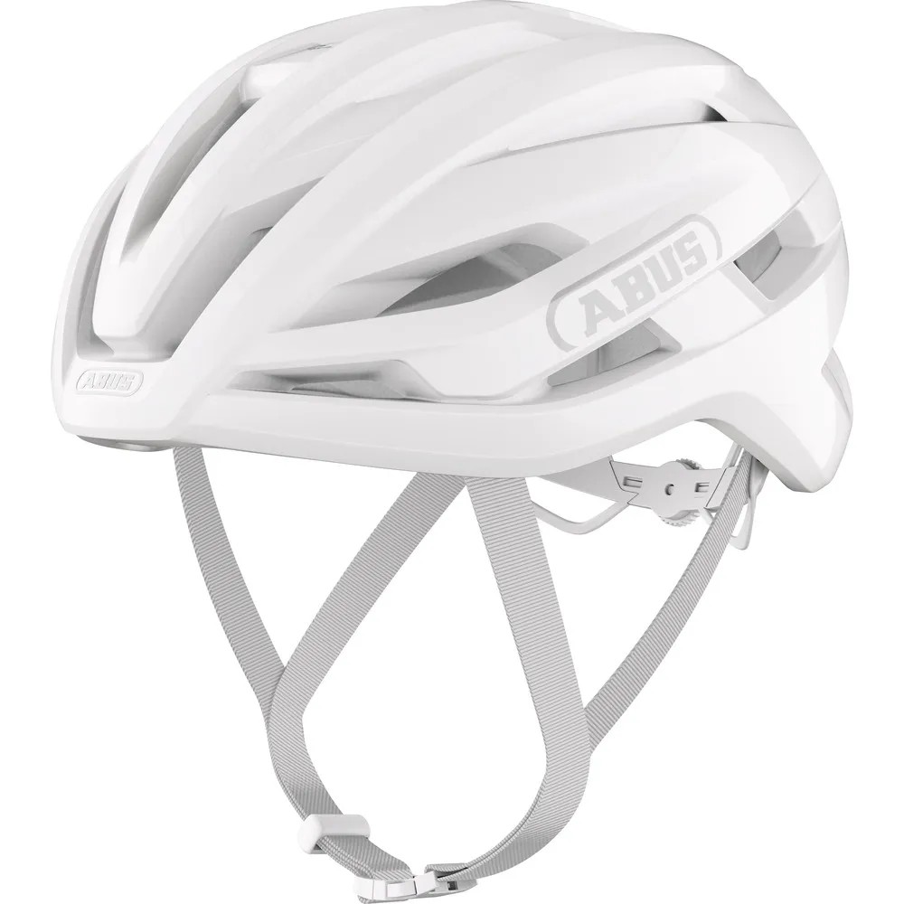 White Abus Stormchaser Ace road cycling helmet featuring a sleek aerodynamic design, adjustable straps, and ventilation openings for enhanced airflow.