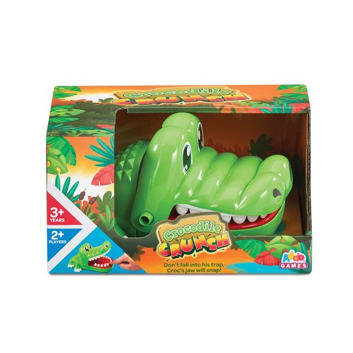 Bright green crocodile head game with a wide open mouth, set in a colorful box featuring jungle graphics, designed for 2+ players aged 3 and up.