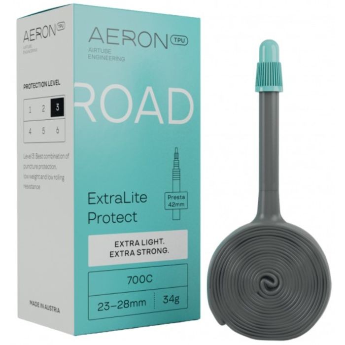 Aeron Road ExtraLite Protect Inner Tube in a coiled design, grey color, with a Presta valve, packaged in a light blue box featuring protection level indicators and product details.