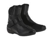 Black leather motorcycle touring boots with a sleek design, featuring a reinforced toe, adjustable Velcro strap, and a comfortable, padded collar for added support.