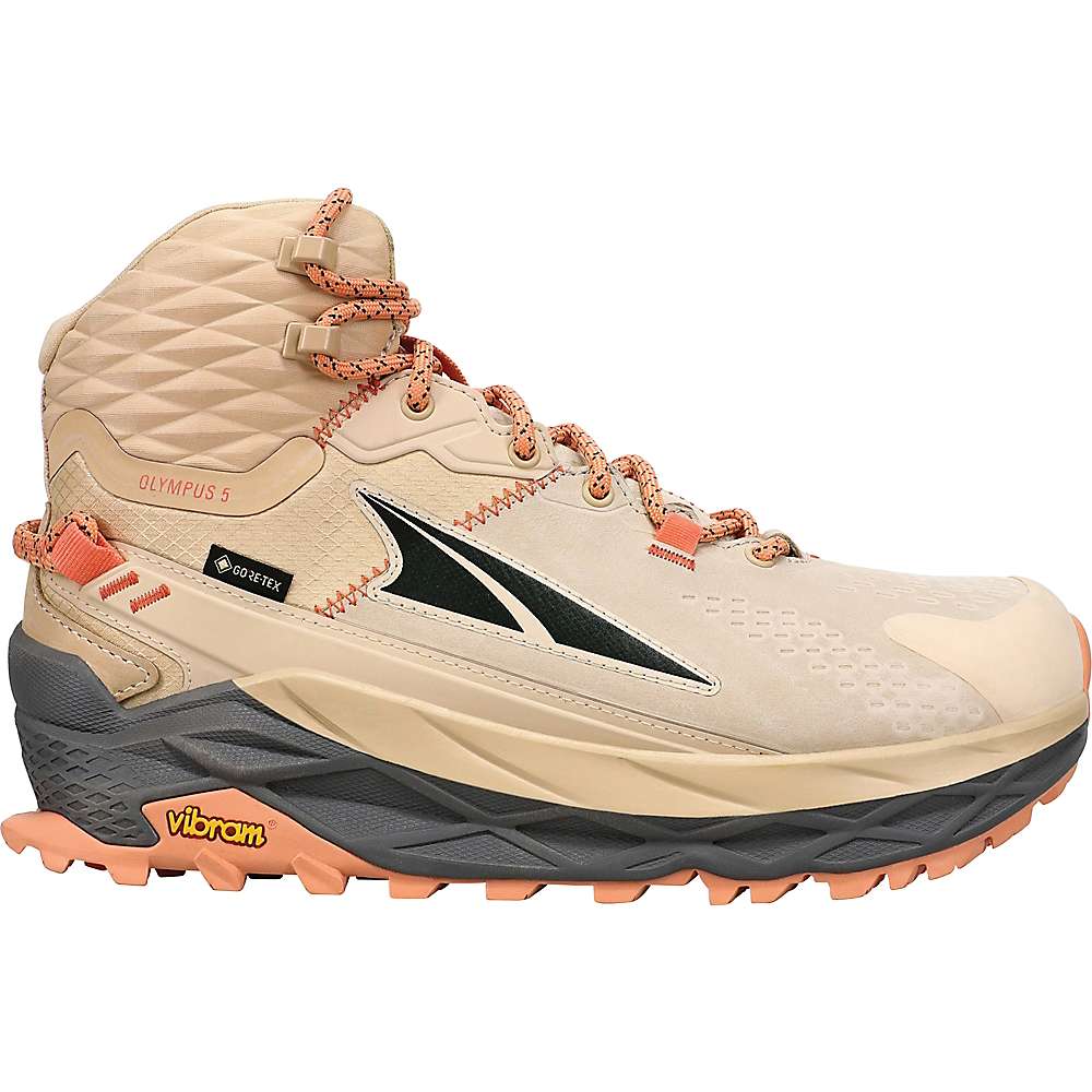 Light sand and brown hiking boot featuring a mid-top design, textured upper, orange laces, and a Vibram outsole for traction. Ideal for outdoor adventures.