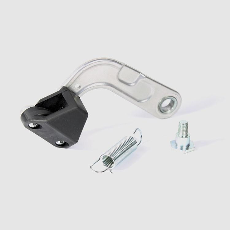 Black and clear plastic chain tensioner with a curved arm, accompanied by a metal spring and bolt, designed for Beta Techno models up to 2000.
