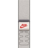 Grey Apple Nike Sport Loop Band with red Nike logo, wavy pattern, made of nylon, recycled polyester, and spandex.
