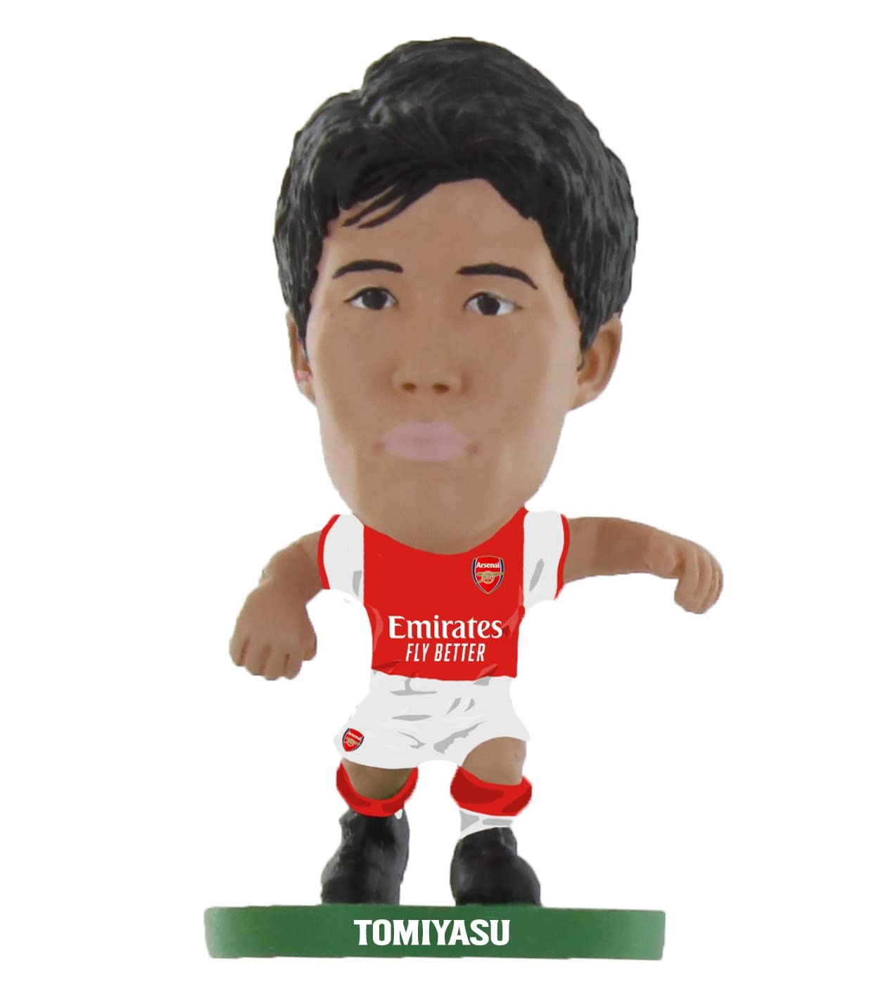 Collectible figurine of Takehiro Tomiyasu in Arsenal's classic home kit, featuring a red and white jersey with "Emirates Fly Better" logo, black shorts, and green base labeled "TOMIYASU."
