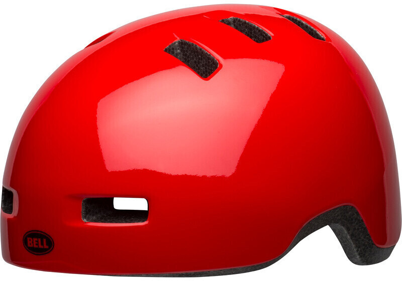 Glossy red Bell Lil Ripper kids helmet featuring ventilation slots, a smooth exterior, and a padded interior for comfort and safety.