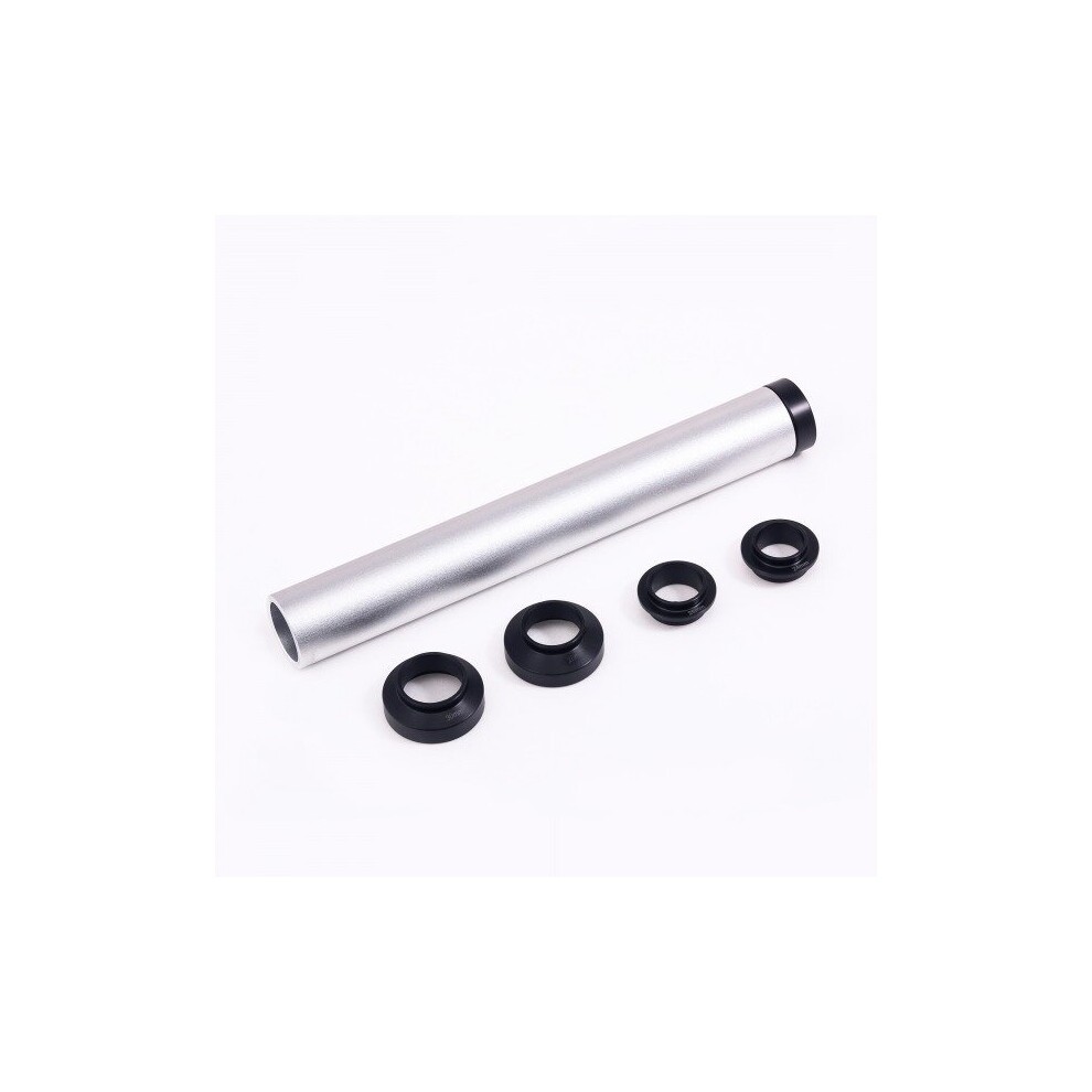Silver aluminum tube with a black end cap, accompanied by four black rubber rings of varying sizes, designed for installing steering tube bearings.