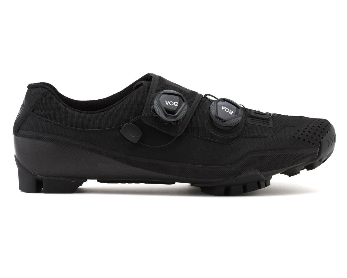 Black Bont Riot G Gravel/XC MTB shoes featuring a wide fit, Asian fit design, dual BOA dial closures, and a rugged sole for enhanced traction on various terrains.