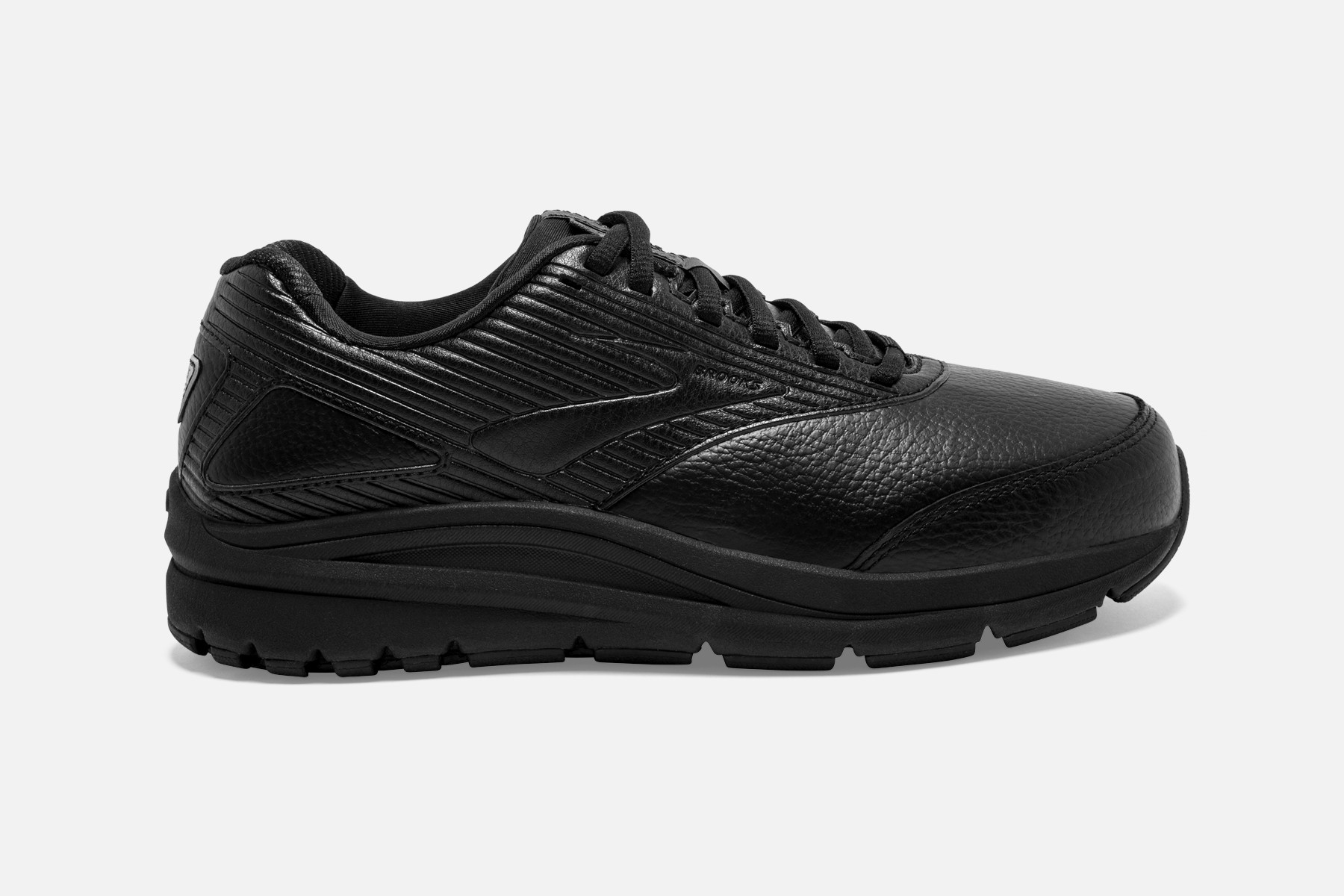 Black leather walking shoe with textured detailing, featuring a cushioned sole and lace-up design, labeled as Brooks Addiction Walker 2 in size 8.5 D for women.