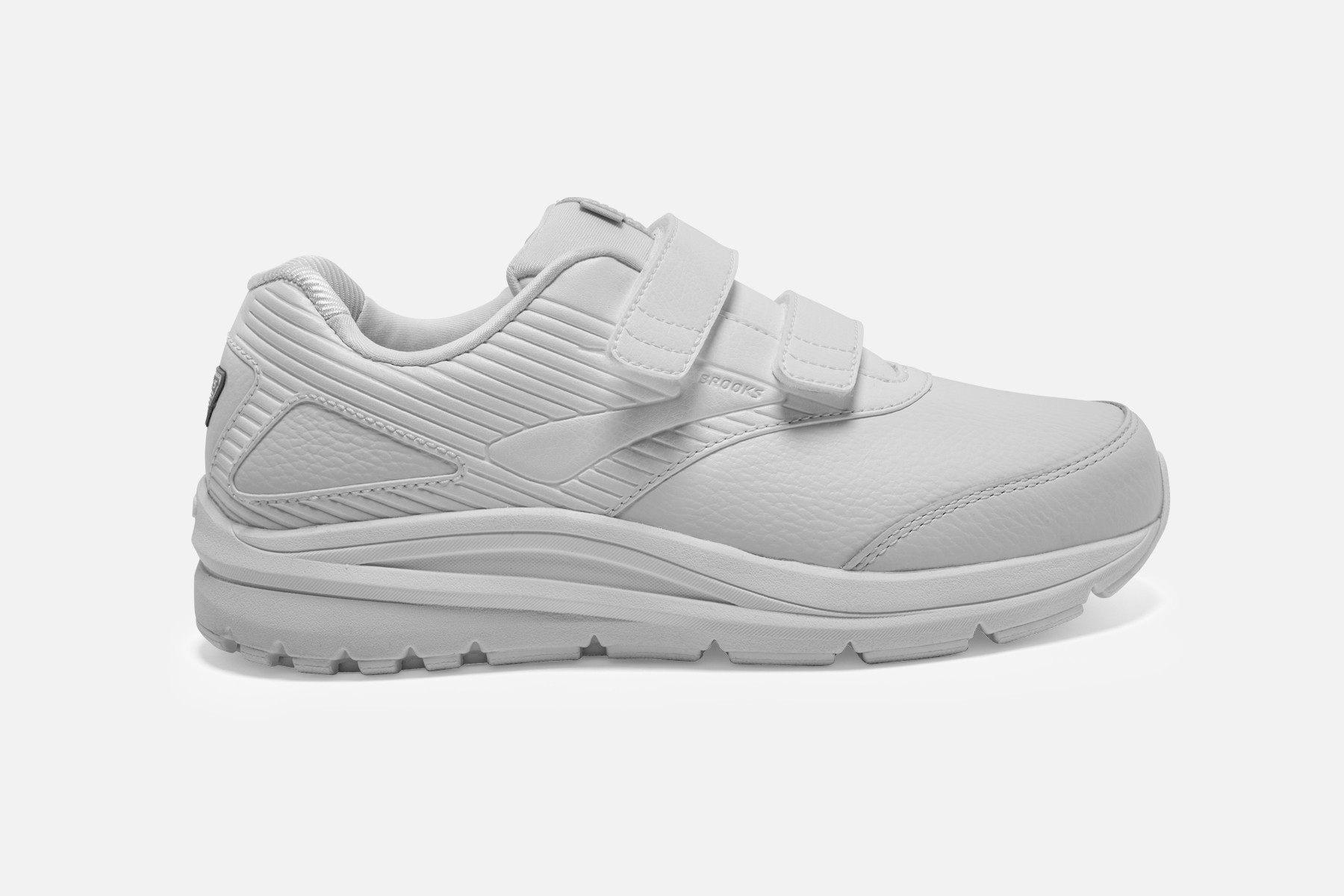White Brooks Addiction Walker V-Strap 2 women's walking shoes, featuring a sleek design, adjustable Velcro straps, and a cushioned sole for comfort.
