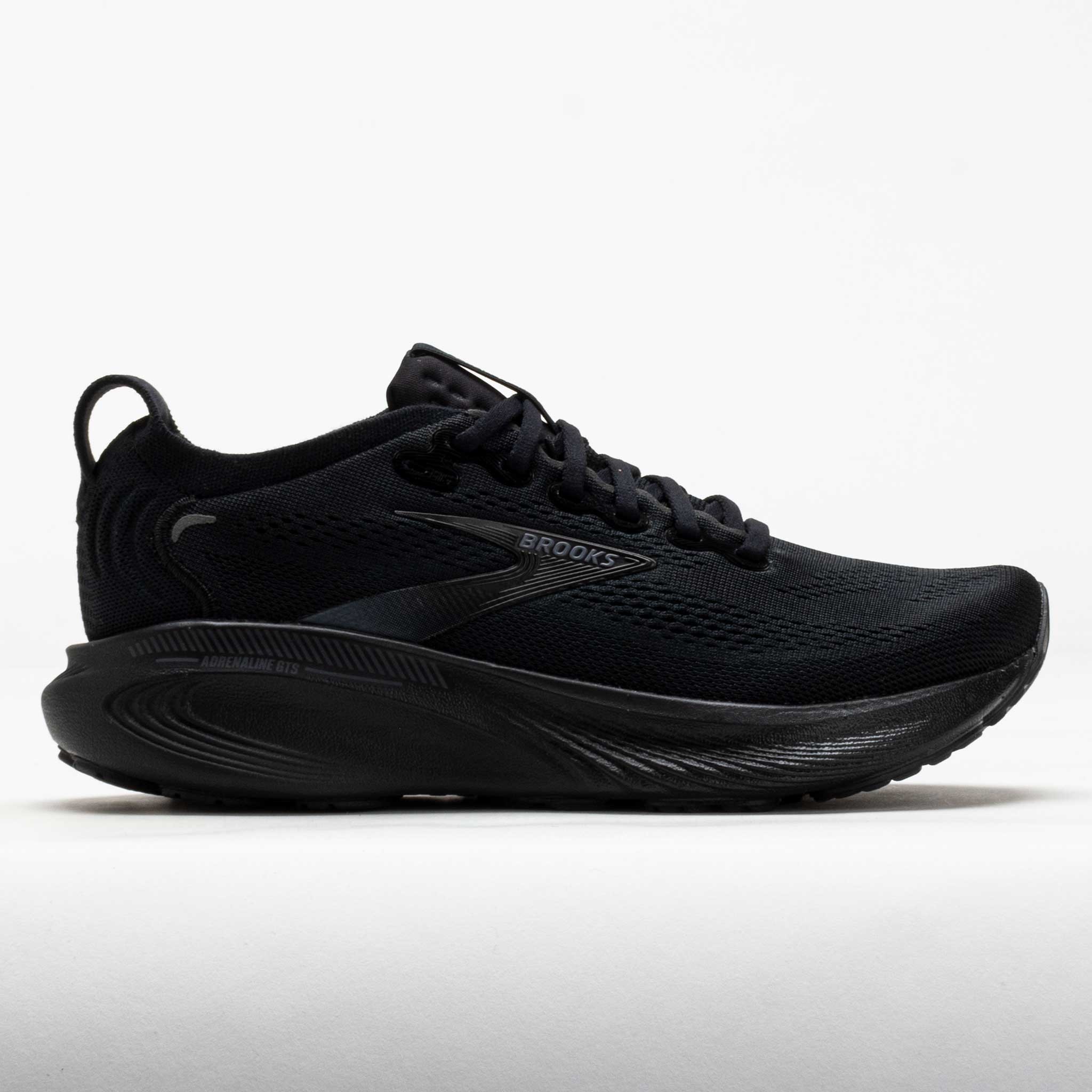 Women's Brooks Adrenaline GTS 25 running shoes in black with a textured mesh upper, cushioned sole, and sleek design, size 9.5 regular.