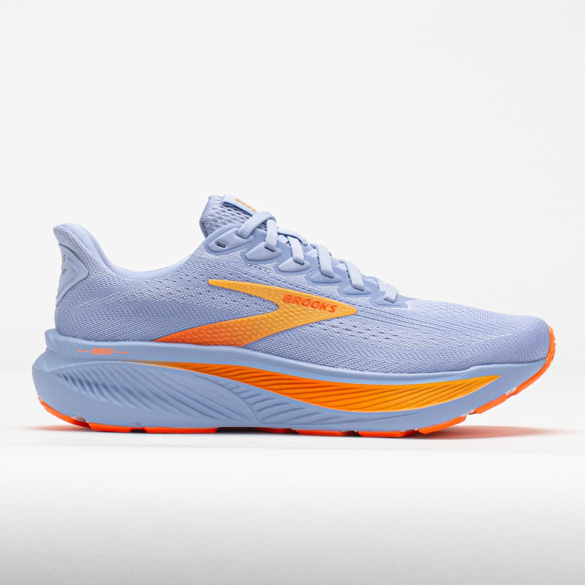Light purple women's running shoe with an orange accent, featuring a breathable mesh upper, cushioned sole, and a sleek design, size 9.5 B by Brooks.