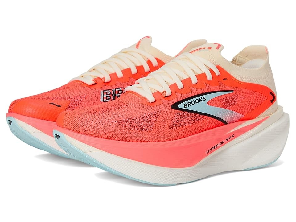 Bright coral and cream women's running shoes with a breathable mesh upper, featuring a prominent Brooks logo and a cushioned sole for maximum comfort.