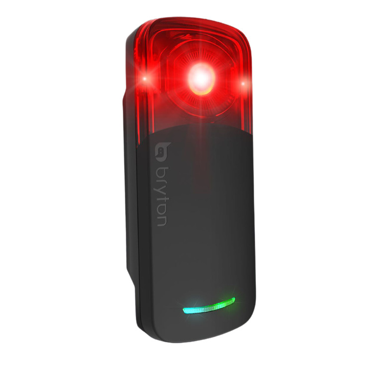 The Bryton Gardia 300L Radar features a sleek black body with a prominent red LED light on top and a green indicator light at the bottom, designed for enhanced visibility.