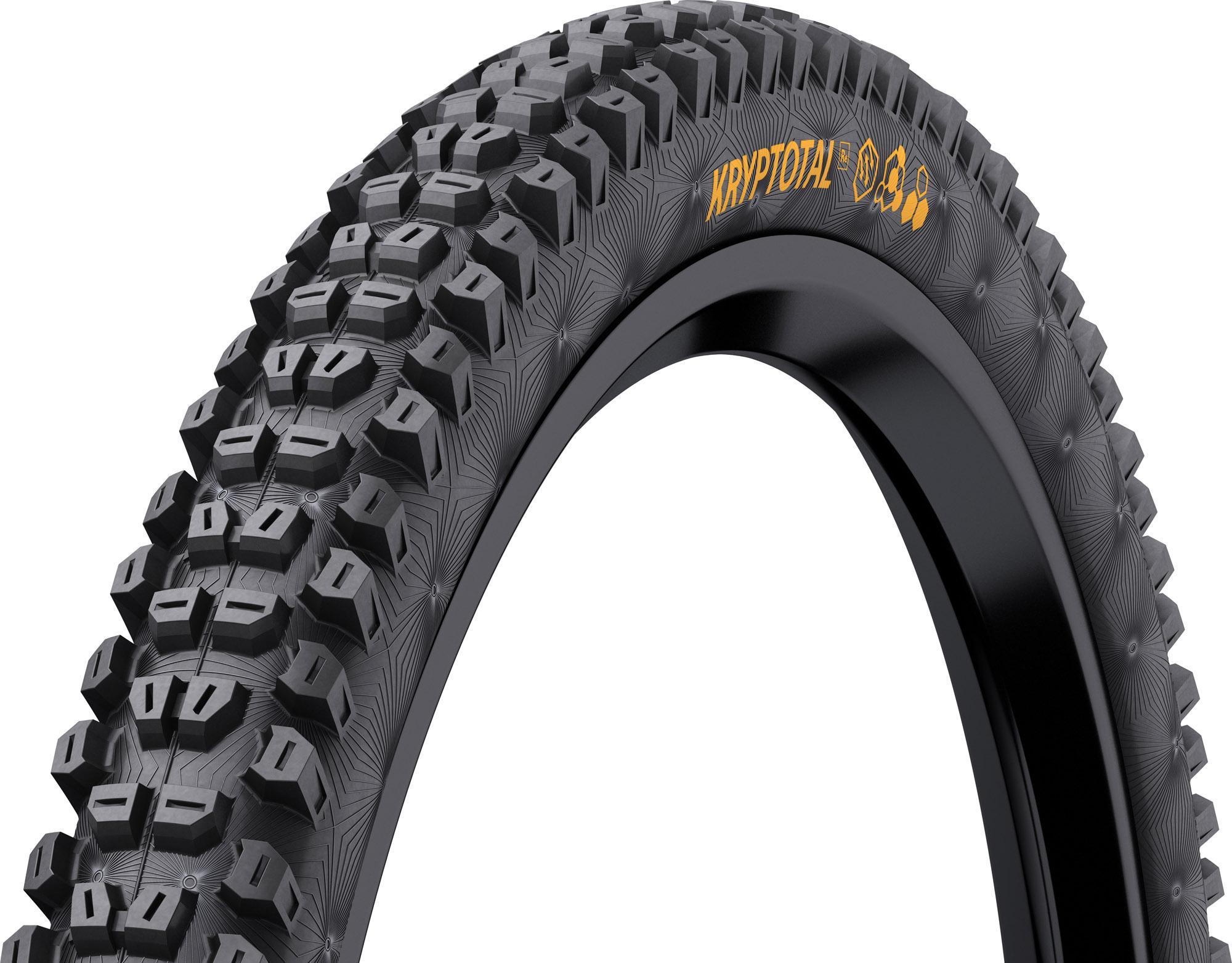 Continental Kryptotal rear tire in size 27.5x2.4, featuring a black rubber surface with prominent, aggressive tread patterns and a yellow "Kryptotal" logo on the sidewall.