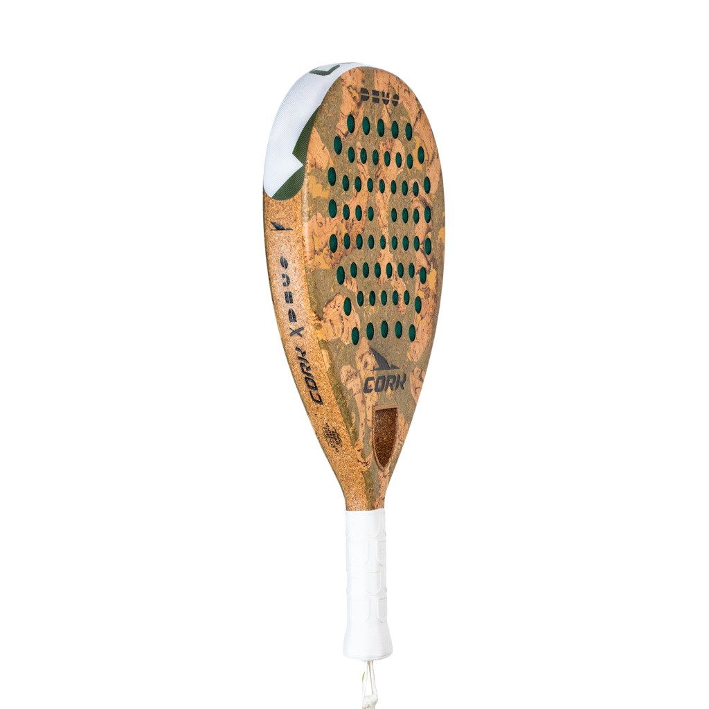 Cork Extreme Deus Padel Racket features a cork surface with a unique design, green perforations, and a white grip handle, emphasizing its eco-friendly material.