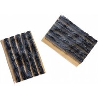Black rubbery tubeless repair plugs on tan backing, textured surface, by Crank Brothers.