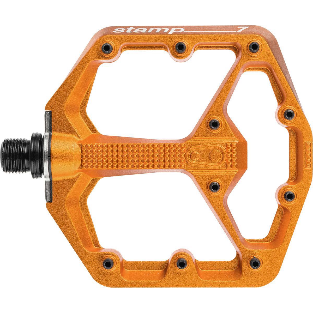 Large Crankbrothers Stamp 7 flat pedal in bright orange, featuring a durable aluminum body, textured grip surface, and a wide platform design for enhanced stability.