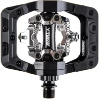 Black DMR V-Twin pedal with wide platform, adjustable pins, and silver clipless mechanism in the center.