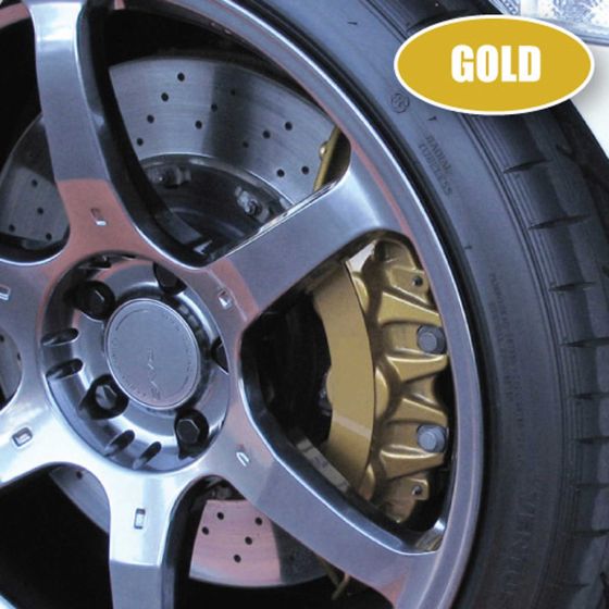 Gold brake caliper mounted on a silver alloy wheel, showcasing drilled brake discs and a glossy finish, with a close-up view of the tire tread.