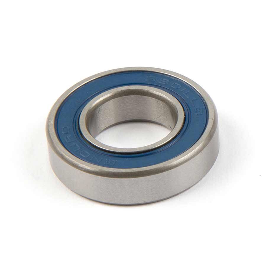 Silver metal cartridge bearing with a blue rubber seal and engraved branding, designed for durability and smooth operation in cycling applications.