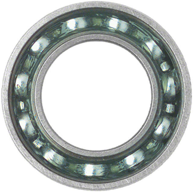 Silver cartridge bearing with a transparent green inner race and steel balls, designed for durability and smooth performance in cycling applications.