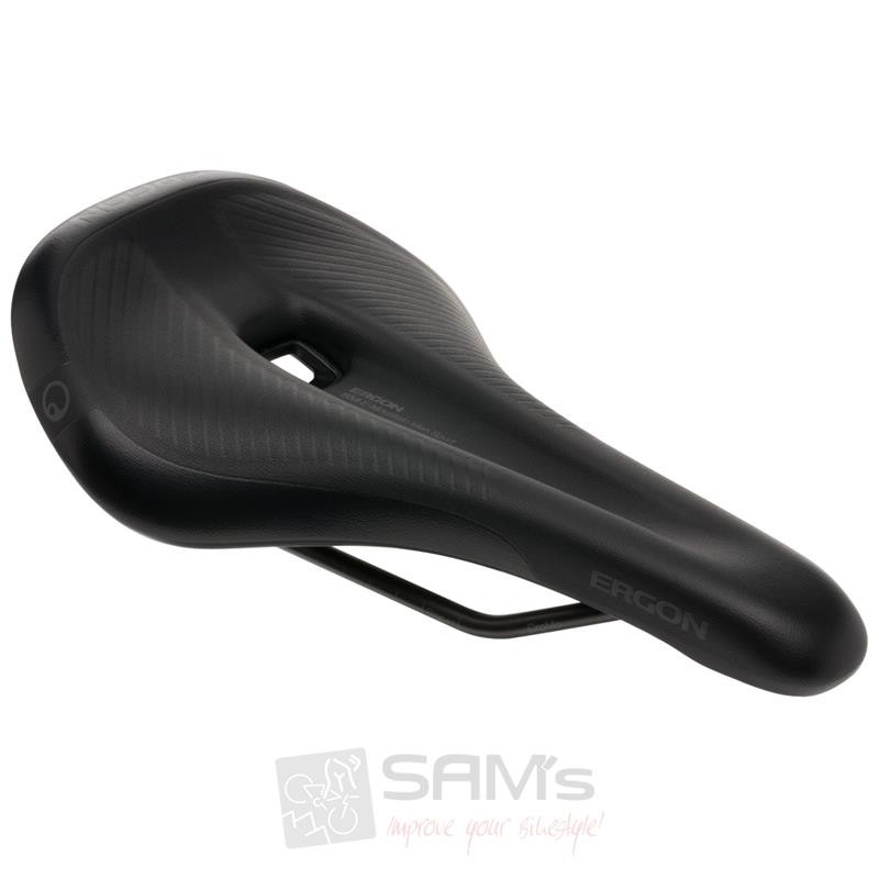Black ergonomic saddle with a sleek design, featuring a textured surface and a cut-out center for comfort, mounted on a durable metal rail.