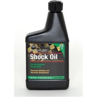 Black Finish Line Shock Oil bottle with green and gold label, black cap, and 16 oz capacity.