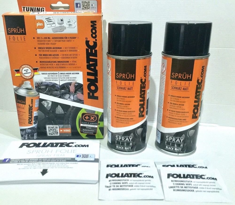 Two cans of Foliatec Spray Film in glossy black, packaged with a box featuring the brand logo and product details, along with instruction leaflets.
