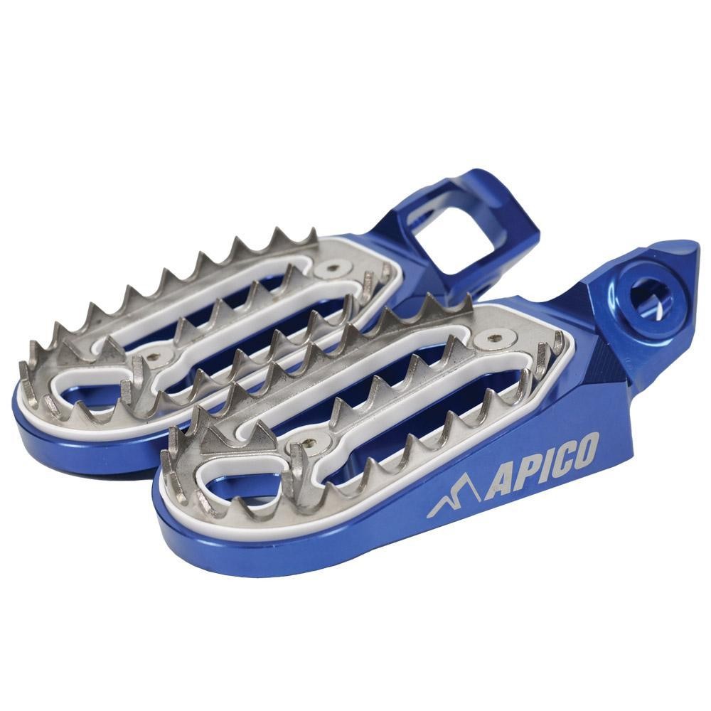 Blue aluminum foot pegs with silver serrated teeth and an engraved "APICO" logo, designed for KTM, Husqvarna, and Gas Gas models from 2023 to 2025.