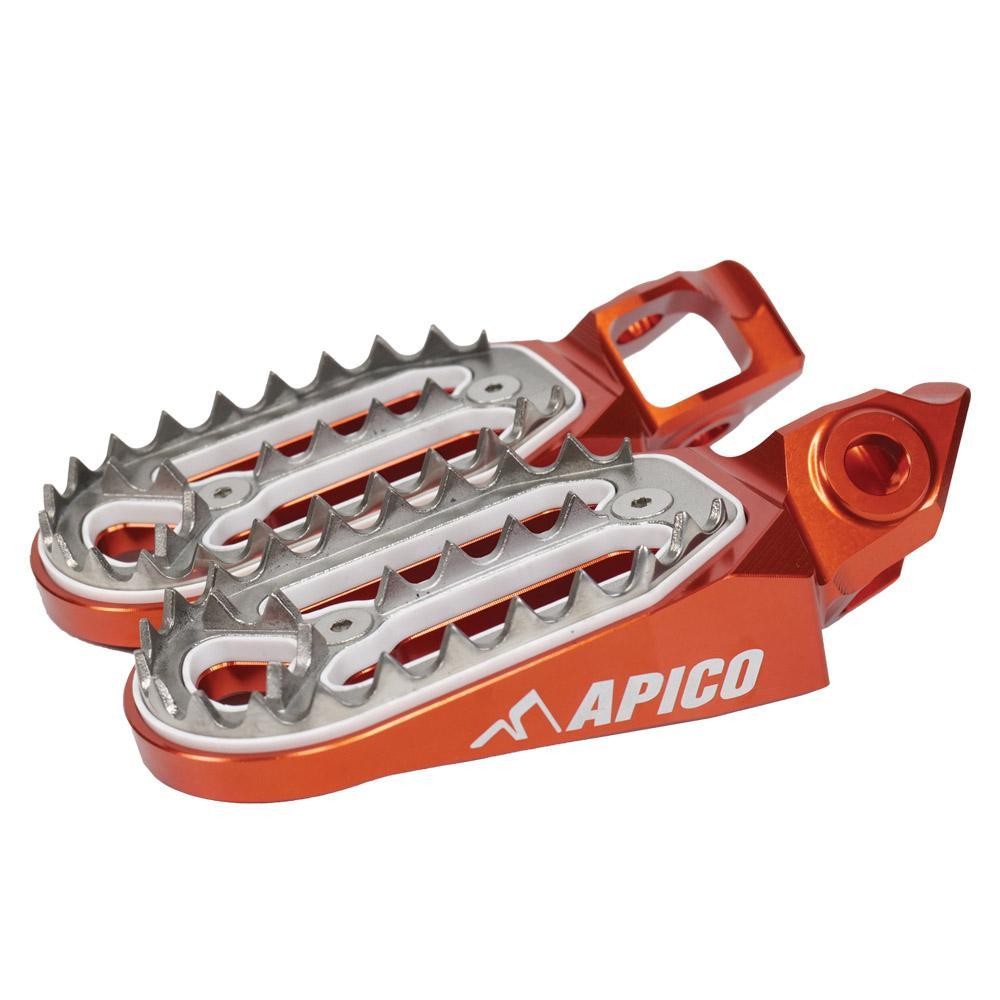 Orange aluminum foot pegs with a silver grip surface and sharp teeth for enhanced traction, featuring the "APICO" logo prominently displayed.
