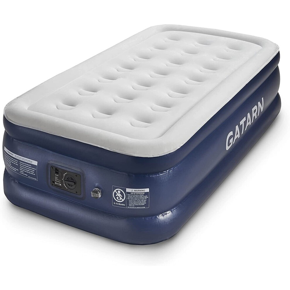 Single size air bed in navy blue with a soft, white top surface; features a built-in electric pump for quick inflation in 2 minutes; durable material with safety warnings on the side.