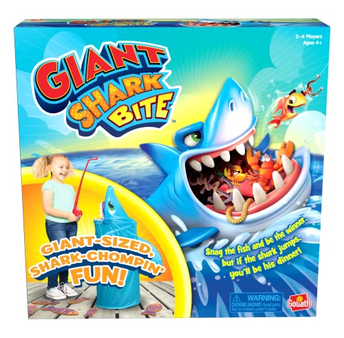Colorful game box featuring a large blue shark with an open mouth, a child holding a fishing rod, and the title "Giant Shark Bite" prominently displayed in bold letters.