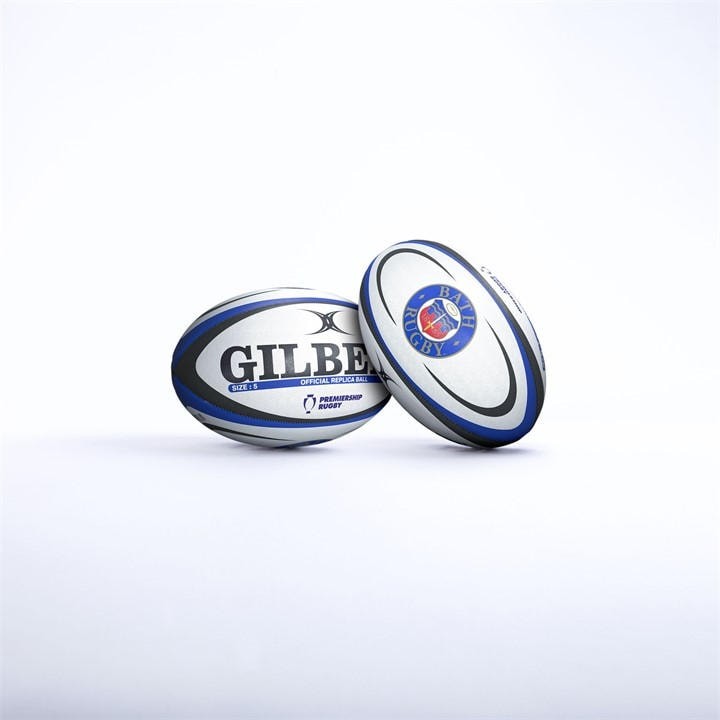 White rugby ball with blue and black accents, featuring "GILBERT" prominently on one side and the Bath Rugby logo on the other, made of durable synthetic material.