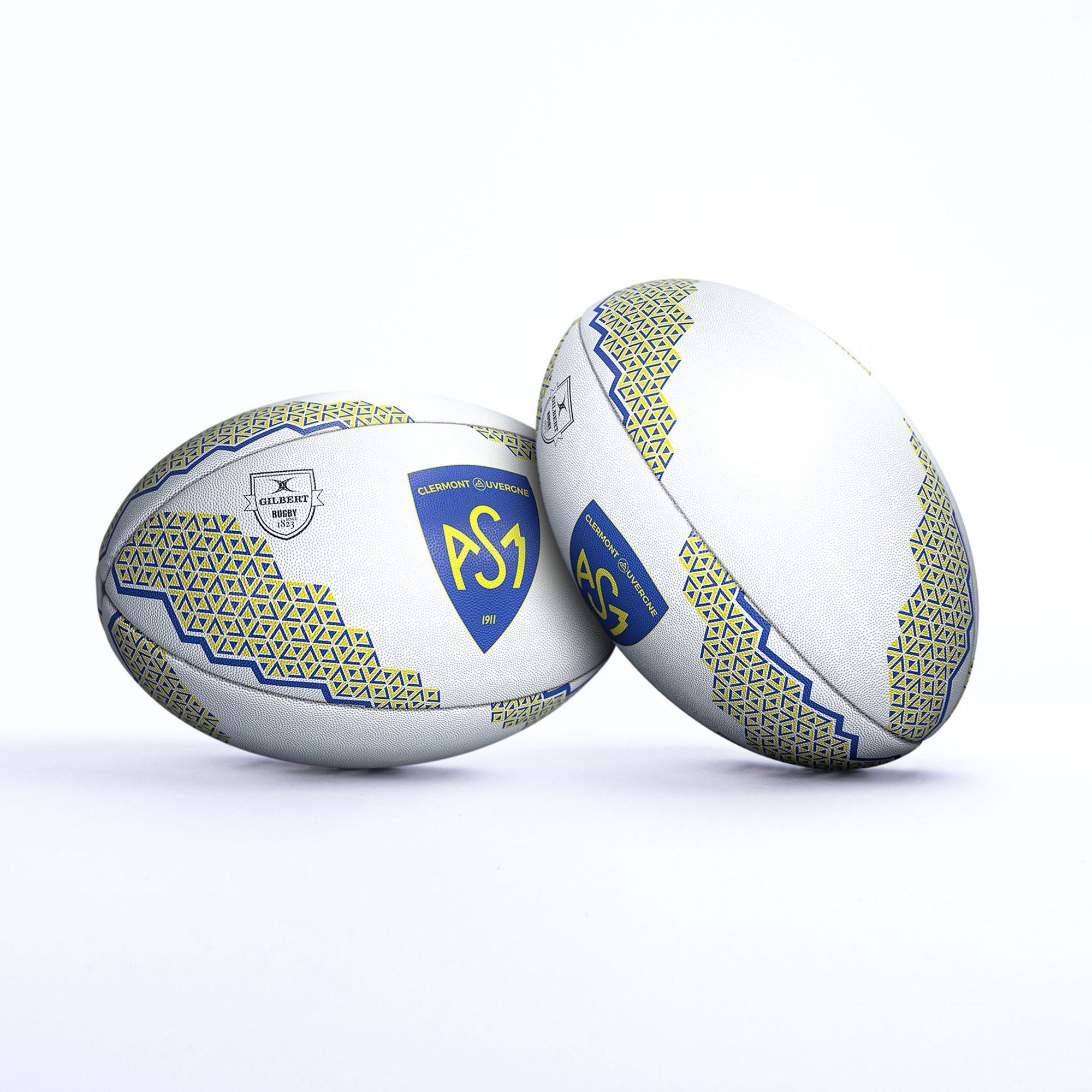 White rugby ball featuring the Clermont Ferrand logo, with blue and yellow geometric patterns and textured grip for enhanced handling.