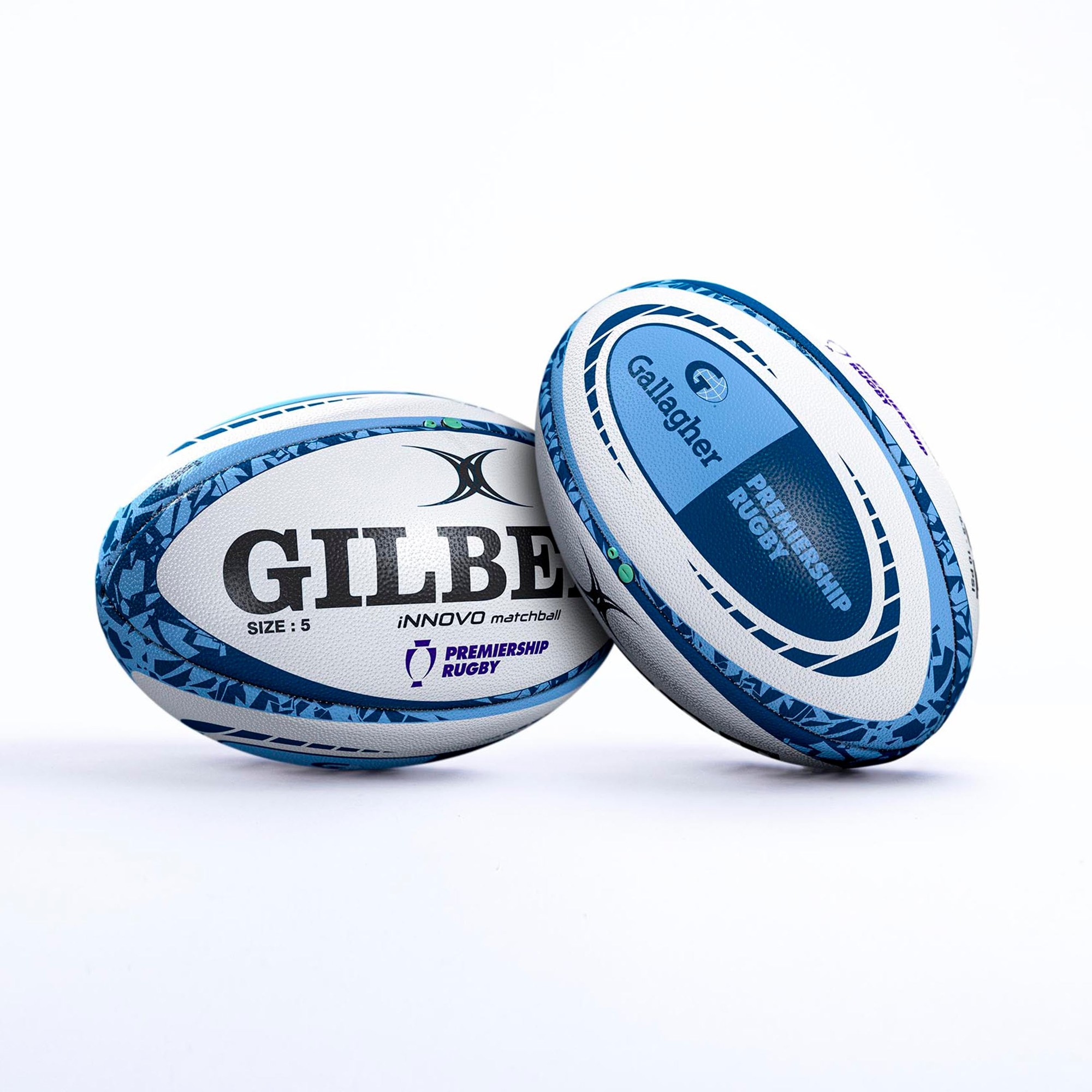 Two Gilbert Gallagher Premiership Rugby Innovo match balls, featuring a white and blue design with textured grip, size 5, and logos for Gilbert and Premiership Rugby.