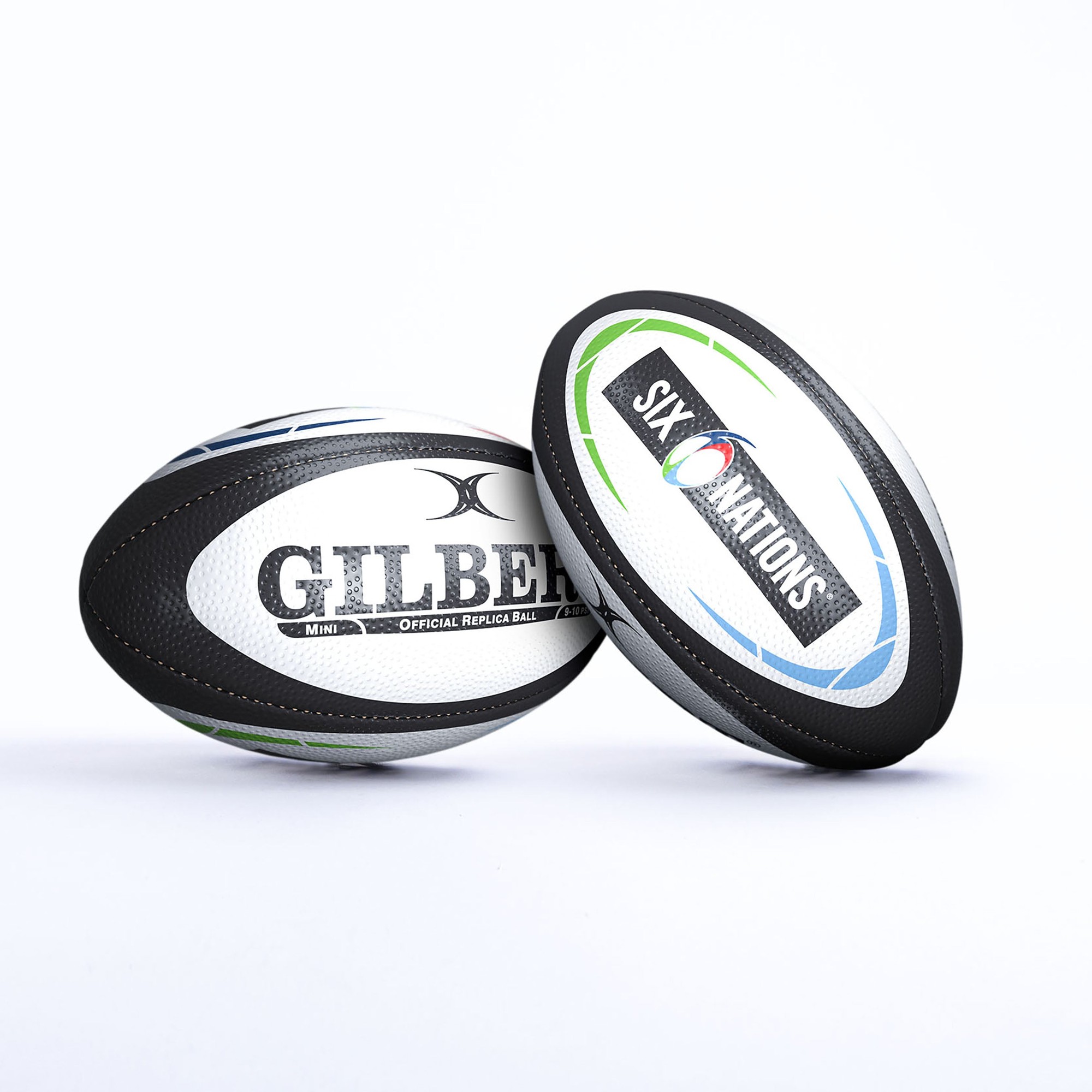 Black rugby ball featuring the "Gilbert" logo and "Six Nations" branding, with a textured surface and vibrant green and blue accents.