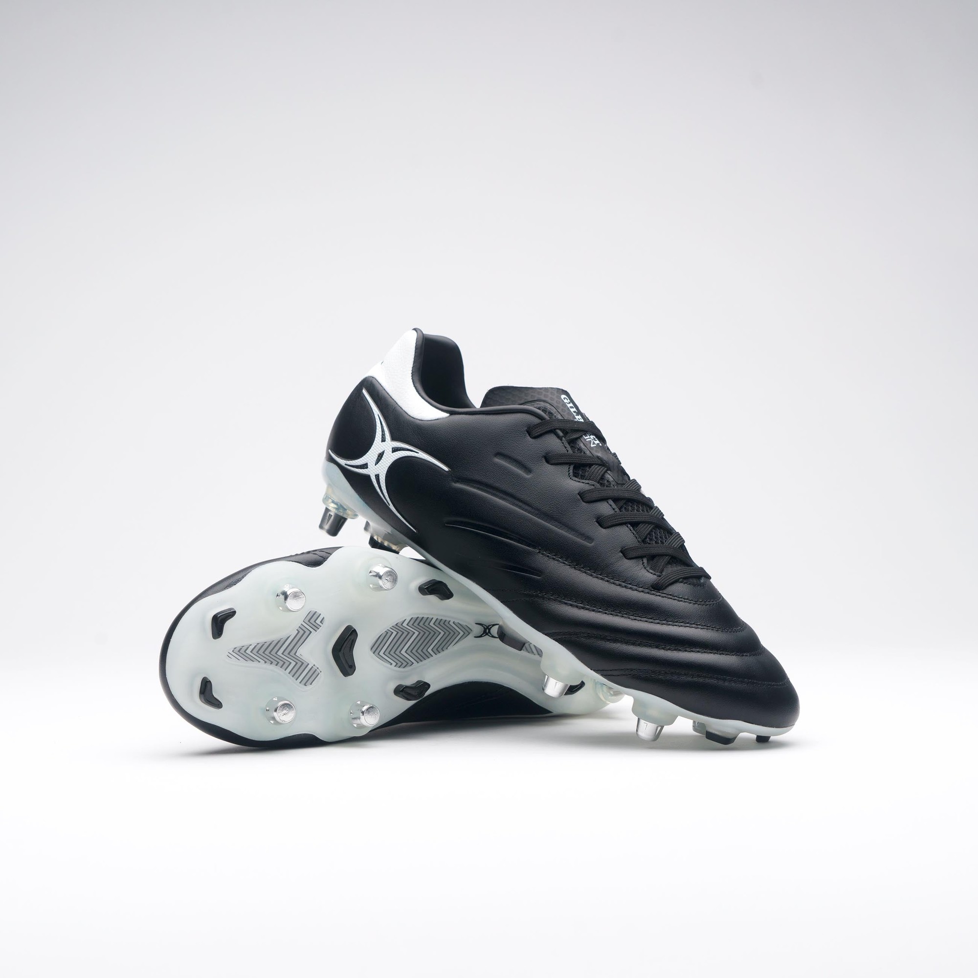 Black Gilbert Rugby Icon 6S boots featuring a sleek design, textured upper, and white detailing, with a durable sole and multiple studs for traction on the field.