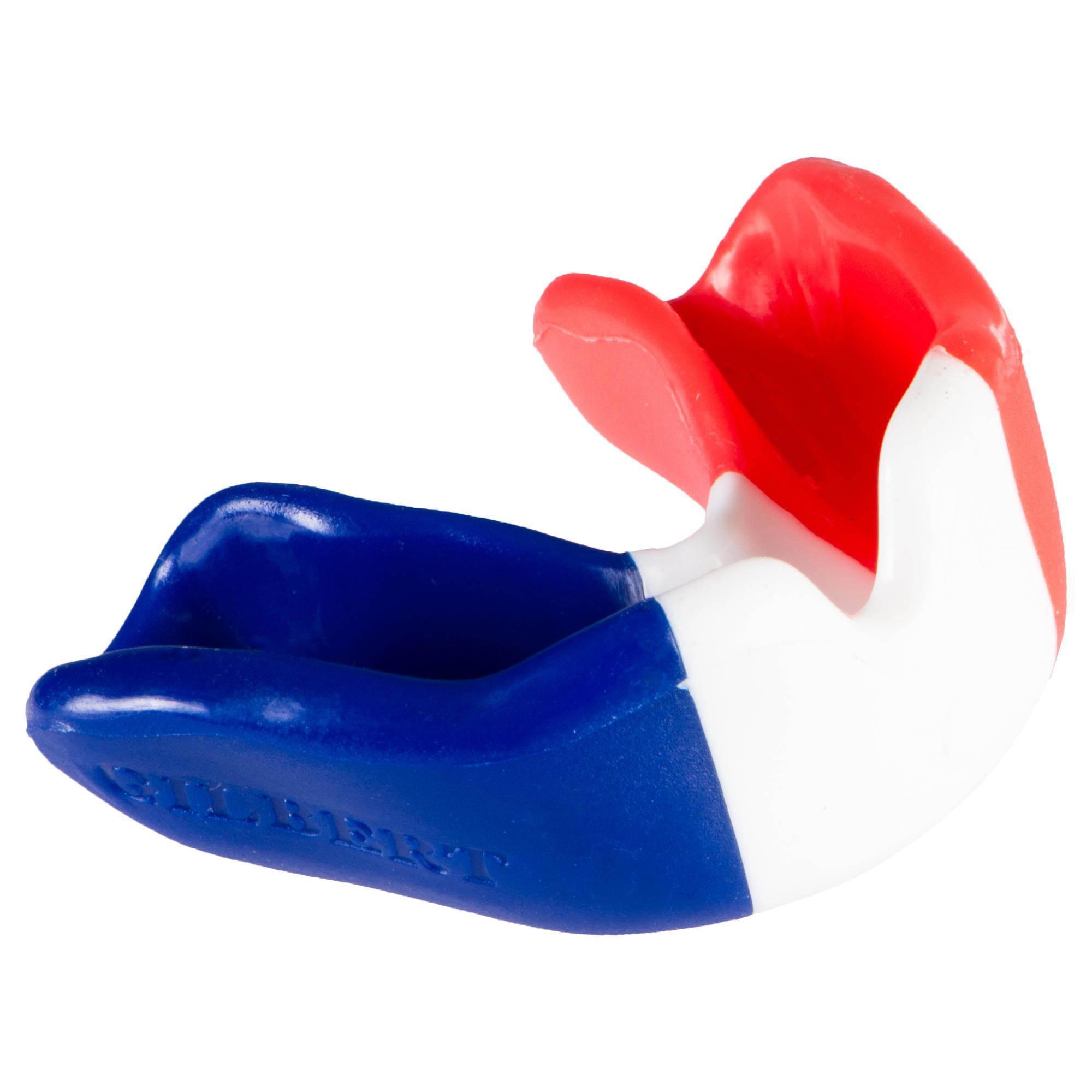Red, white, and blue mouthguard featuring the French flag design, made of flexible material with "GILBERT" embossed on the side, ideal for rugby players.