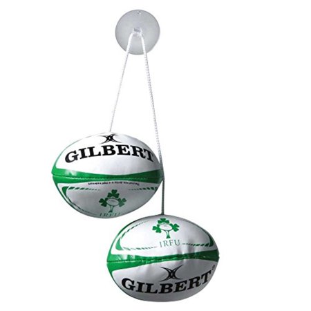 Two white rugby ball keyrings featuring green and black accents, displaying the "Gilbert" logo and the Ireland Rugby emblem, attached by a clear string.